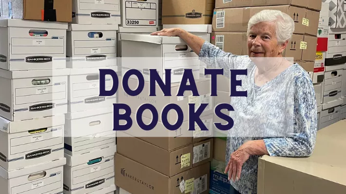 bookstore volunteer packing up donated books for book sales
