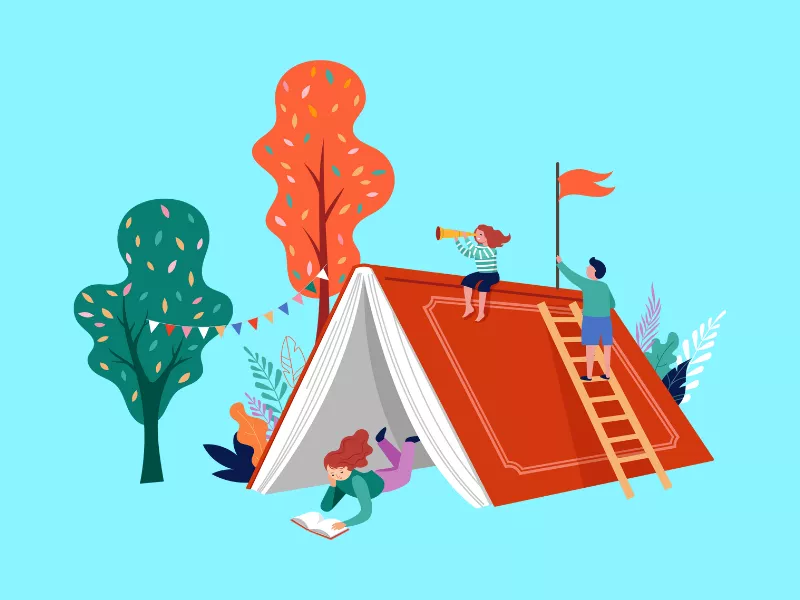 Book-shaped tent with children playing underneath it