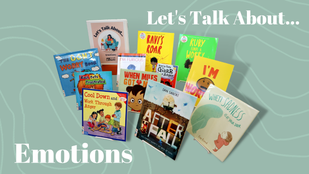 Ten children's picture books and a binder propped on easels. The binder is labeled "Let's Talk About... Emotions"
